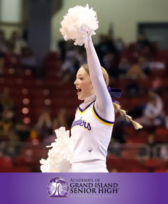  GISH Cheerleader cheering in front of a large crowd.