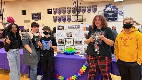 GISH LGBTSA students at Islander 8th Grade Extravaganza standing in front of their booth