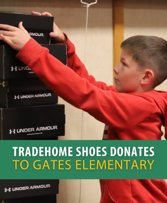  Photo of Gates student stacking shoe boxes with green banner and text.