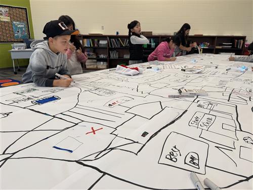 students drawing a city