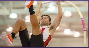 Kevin Cahoy pole vaulting for the University of Nebraska at a meet.