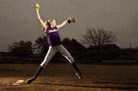 Lindsey Telecky pitching on the softball mound in her Islanders gear