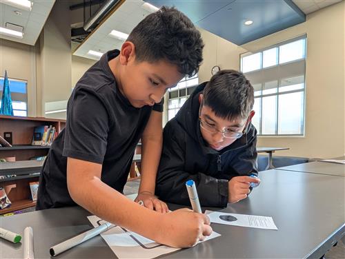 students working with ozobots